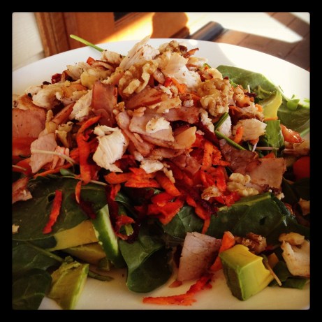 Chicken Caesar salad. Spinach, sprouts, avocado, grated beetroot and carrot, cucumber, chicken, bacon, walnuts, lemon juice, olive oil.